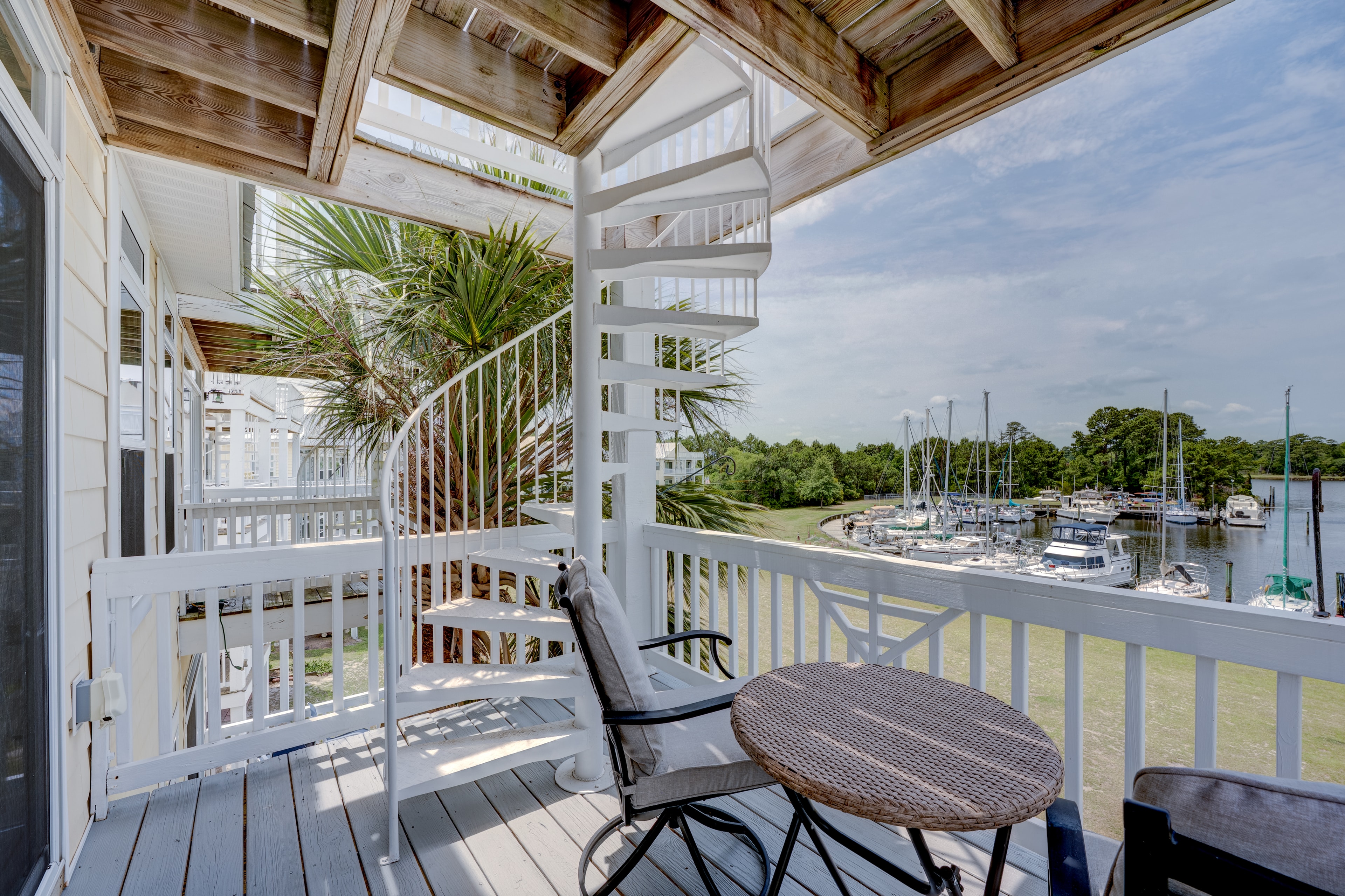 Deck off the master bedroom with spiral staircase and marina views
